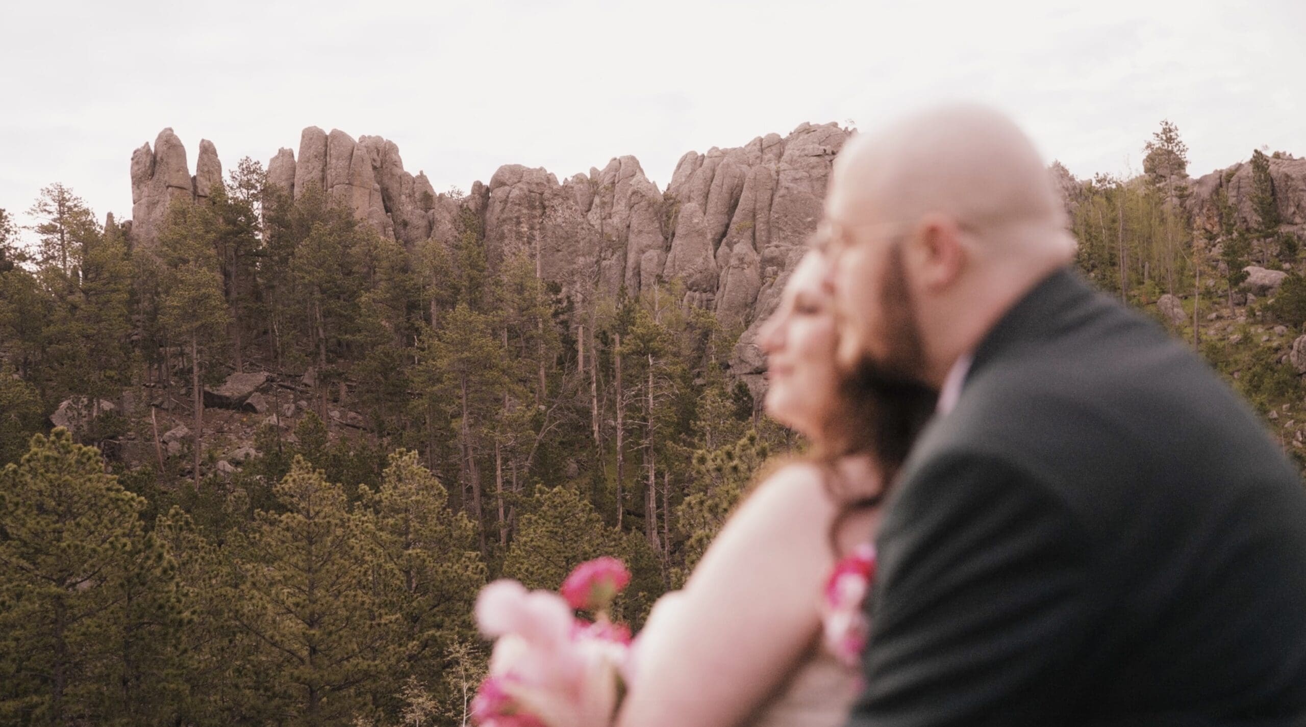 A couple who booked Nathaniel Wilson Video as their elopement videographer enjoying the views of Needles Highway in Custer State Park, South Dakota.